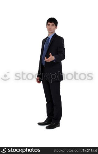handsome businessman shaking hands with someone