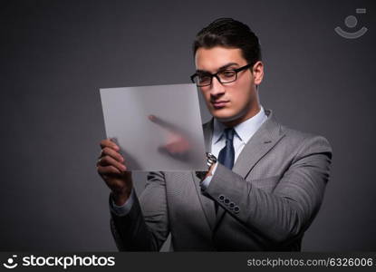 Handsome businessman working on tablet computer