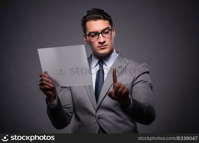 Handsome businessman working on tablet computer