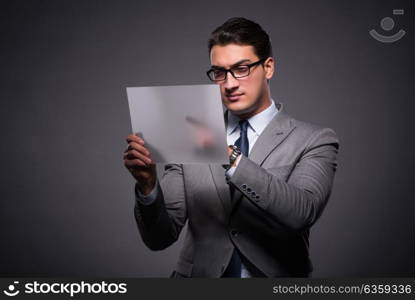 Handsome businessman working on tablet computer