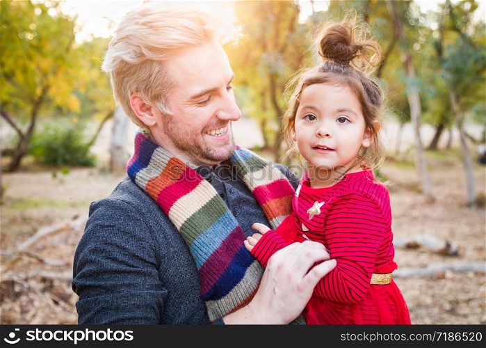 Handsome Caucasian Young Man with Mixed Race Baby Girl Outdoors.. Handsome Caucasian Young Man with Mixed Race Baby Girl Outdoors