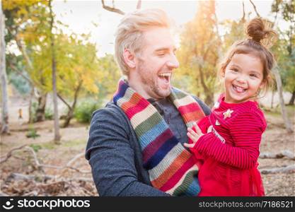 Handsome Caucasian Young Man with Mixed Race Baby Girl Outdoors.. Handsome Caucasian Young Man with Mixed Race Baby Girl Outdoors