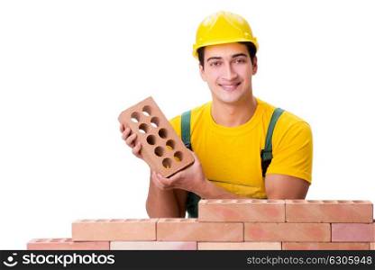 Handsome construction worker building brick wall