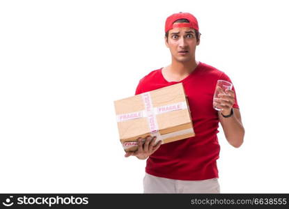 Handsome contractor holding fragile box isolated on white 