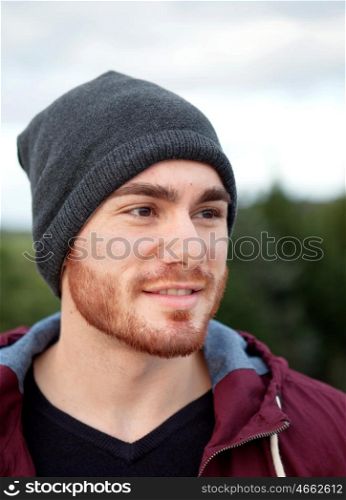 Handsome cool young man with cap wool