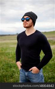 Handsome cool young man with sunglasses and cap wool&#xA;