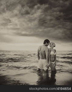 Handsome couple in the sea