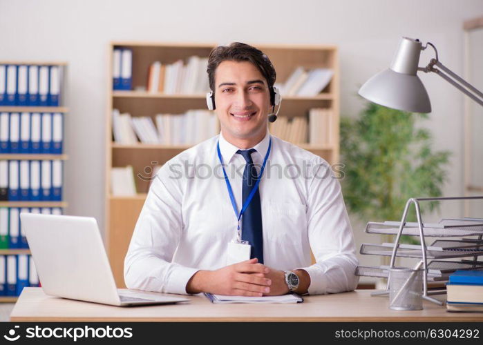 Handsome customer service clerk with headset