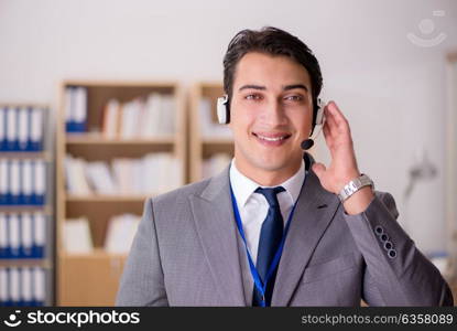 Handsome customer service clerk with headset