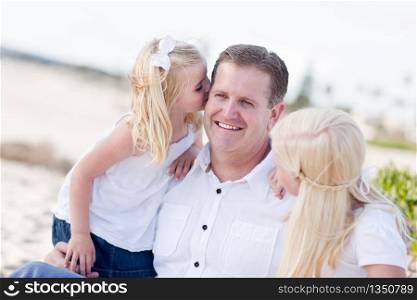 Handsome Dad Getting Kisses from His Cute Daughters at The Beach.