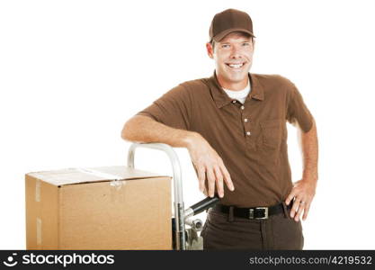 Handsome delivery man leaning on his dolly filled with boxes. Isolated on white.