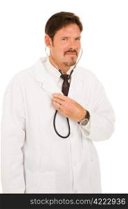 Handsome doctor listening to his own chest with a stethoscope. Isolated on white.
