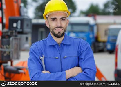 handsome engineer with hard hat and plan