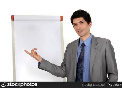 handsome executive pointing at board