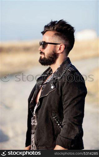 Handsome guy with leather jacket and sunglasses