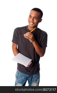 Handsome happy student standing thinking with pencil and notepad coming up with ideas, on white.