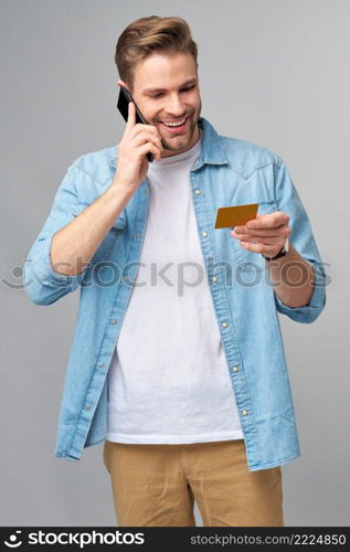 Handsome happy young man showing blank bank cor discount card.. Handsome happy young man showing blank bank cor discount card