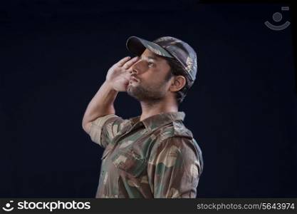 Handsome Indian soldier saluting