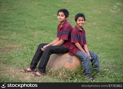 Handsome Indian toddler standing outdoor smiling