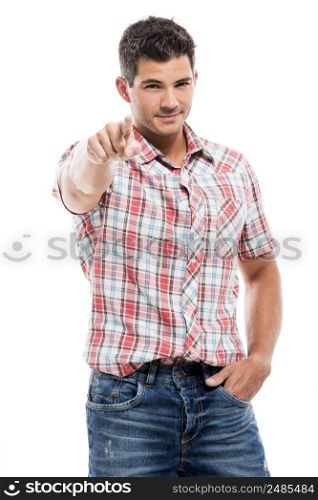 Handsome latin man pointing to the camera, isolated over a white background