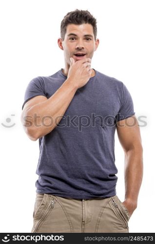 Handsome latin man with a astonished face, isolated over a white background
