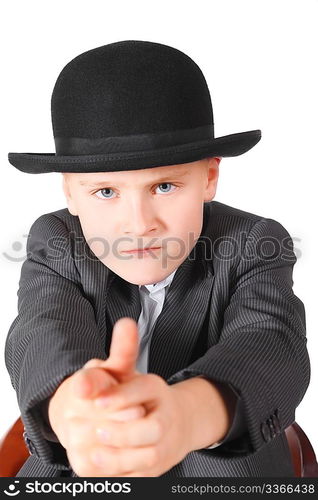 handsome little boy wearing suit and hat is playing gangster. isolated.