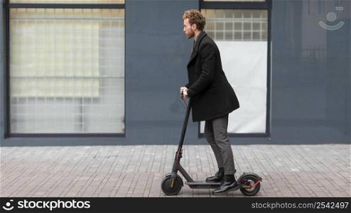 handsome male riding electric scooter 5