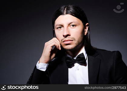 Handsome man against the dark background