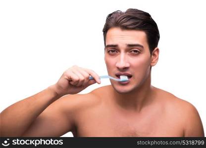 Handsome man brushing his teeth isolated on white
