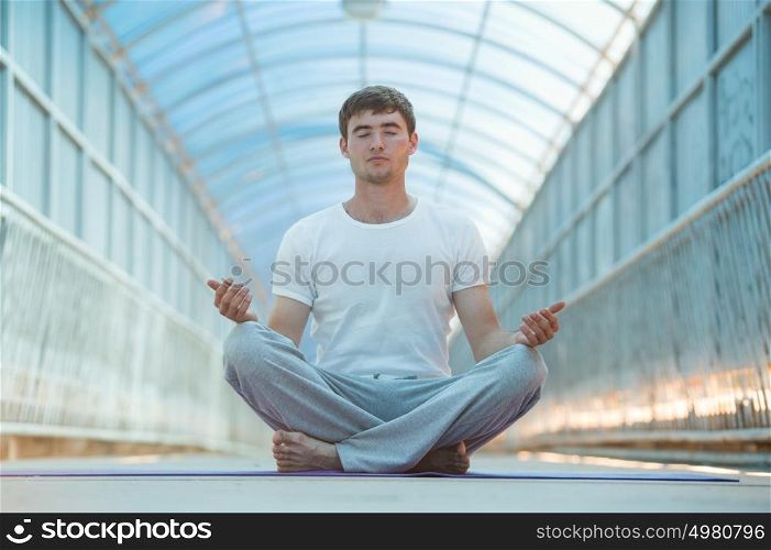 Handsome man doing yoga