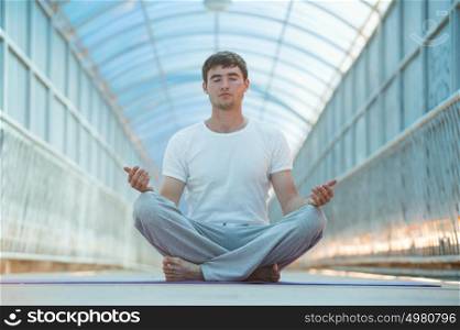 Handsome man doing yoga