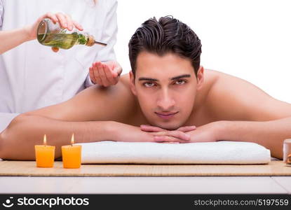 Handsome man during spa massaging session