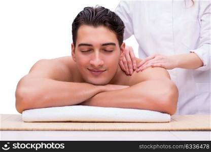 Handsome man during spa massaging session