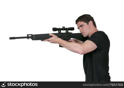 Handsome man holding an automatic assault rifle