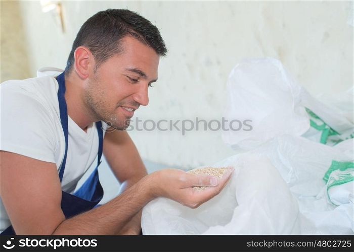 handsome man holding flour on his hand