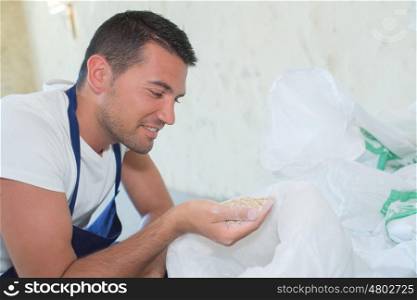 handsome man holding flour on his hand