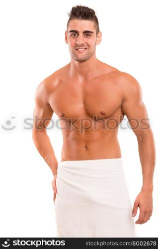 Handsome man in a great shape, isolated over a copy space background