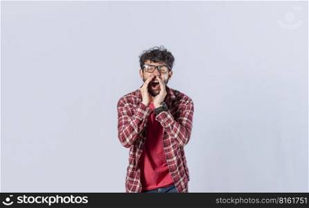 Handsome man in glasses shouting an announcement, isolated. A person announcing and yelling, concept of a guy yelling an announcement