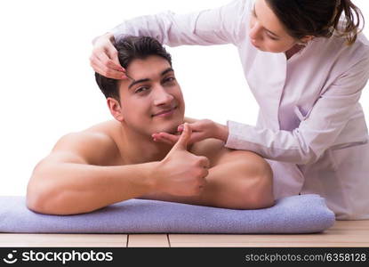 Handsome man in spa massage concept