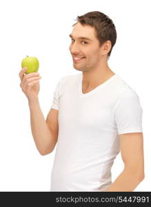 handsome man in white shirt with green apple