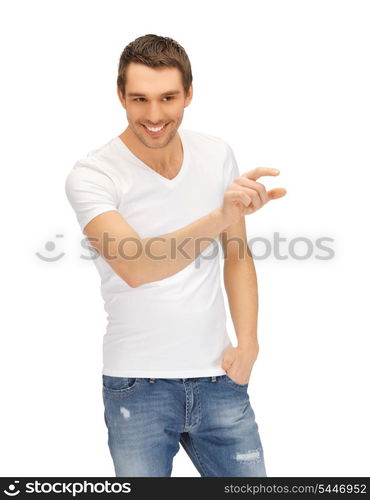 handsome man in white shirt working with something imaginary