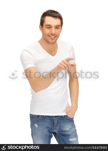 handsome man in white shirt working with something imaginary