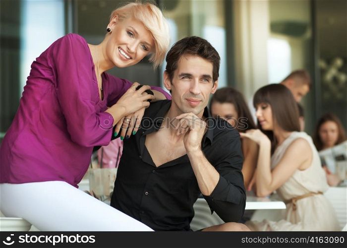Handsome man next to cheerful women