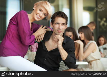 Handsome man next to cheerful women