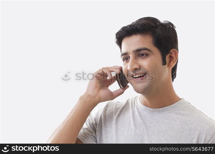 Handsome man on the phone over white background