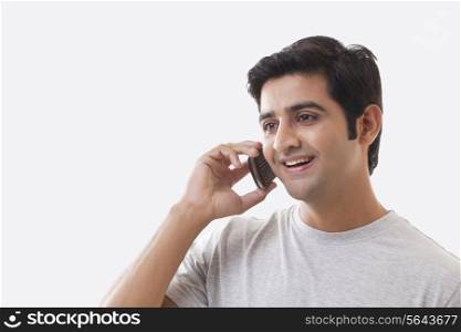 Handsome man on the phone over white background
