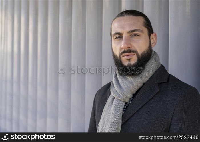 handsome man posing outdoors with copy space