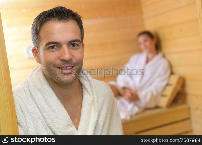 handsome man relaxing in sauna and staying healthy