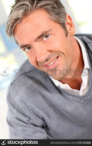 Handsome man relaxing in sofa at home