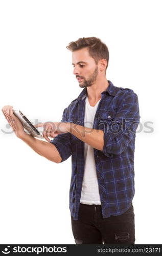 Handsome man relaxing with a tablet computer